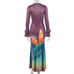 Detail of artistic gradient maxi dress with bird of paradise print and ruffled cuffs