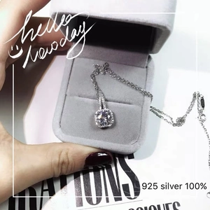 Close-up of 925 sterling silver cushion cut diamond necklace in a velvet jewelry box