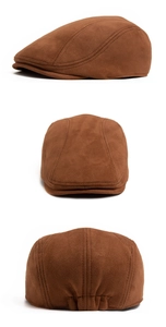 Detail view of brown suede flat cap showing front, side, and elastic back design