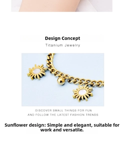 Detail of titanium gold chain bracelet with sunflower shell charm and gold beads