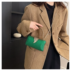 Green sequined evening clutch bag with elegant gold metal handle and chain strap