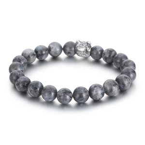 Men's beaded bracelet with dark grey stones and a silver wolf head charm on white background
