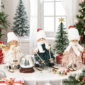 Three Christmas ski dolls with wooden skis and knitted hats in a cozy holiday scene