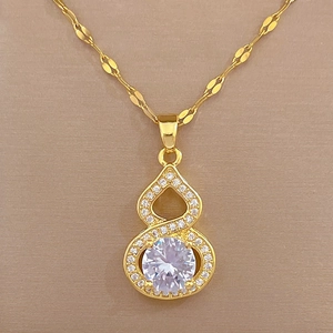 Detailed view of titanium steel gold necklace with sparkling gourd-shaped stone pendant