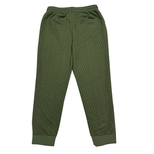 Detail of army green knitted joggers featuring diamond jacquard texture and elastic cuffs