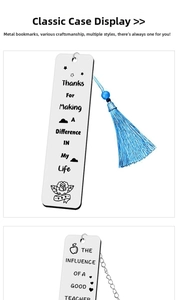 Detail of engraved stainless steel bookmark with blue silk tassel and floral patterns