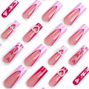 Pink press-on nails with 3D pearl hearts and strawberry patterns in long French style