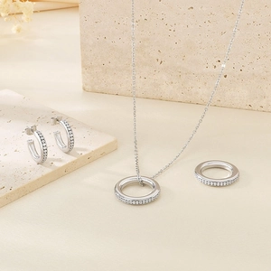 Elegant silver stainless steel jewelry set with sparkling cubic zirconia round pendants