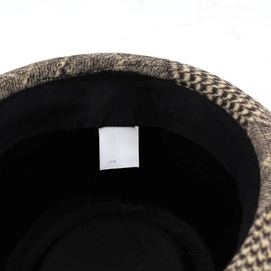 Detail shot of hat care label showing 58CM size and fabric blend of cotton and polyester