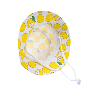 Detail of white sun hat with yellow lemon prints, featuring mesh lining and chin strap