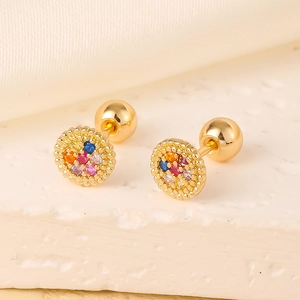 Close-up of 18K gold earrings with colorful cubic zirconia on silk and stone background