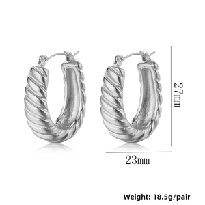 Detail view of silver croissant hoop earrings showing 27mm height and 23mm width dimensions