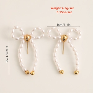 Detail showing bow knot faux pearl earrings with size dimensions and weight info