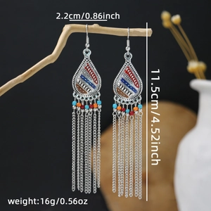 Detail view of Bohemian tassel earrings with colorful beads and silver-tone chains