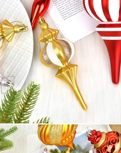 Macro detail of red and white painted onion-shaped Christmas tree ornaments and glitter