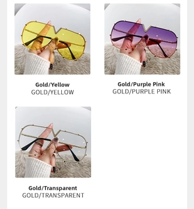 Detailed view of oversized metal frame sunglasses with V-bridge and textured temples