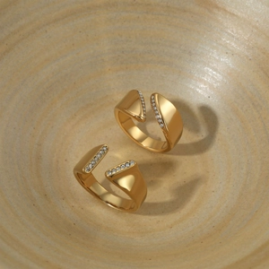 Minimalist gold plated open ring featuring asymmetric geometric facets and zircon inlay