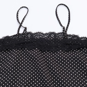 Women's black polka dot camisole with lace trim and elegant spaghetti straps