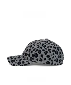 Side view of a grey leopard print corduroy baseball cap with a curved brim design