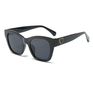Fashionable black square sunglasses for women featuring elegant gold heart detail decor
