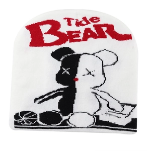 Close-up of Tide Bear knit beanie featuring two-tone bear embroidery and gothic lettering