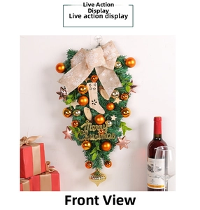 Detailed Christmas teardrop swag with gold ornaments, festive bows and wood socks hanging