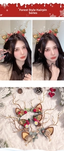 Detail of Christmas reindeer antler hair clips with pinecones and festive floral decor