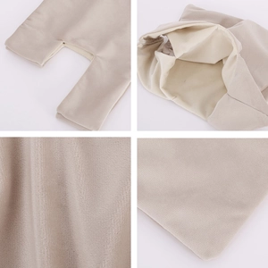 Detail of soft cream velvet fabric and stitching on the interior lining of the handbag