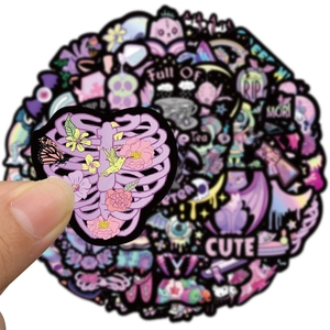 Pastel Goth vinyl stickers set featuring purple and black skull patterns for DIY laptops