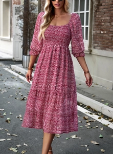 Detail of red leopard print dress with square neck, puff sleeves and high waist design