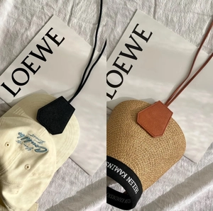 Outdoor leather magnetic hat clip for handbags shown on straw hat and baseball cap