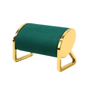 Green velvet cylinder watch stand with gold metal frame for jewelry display