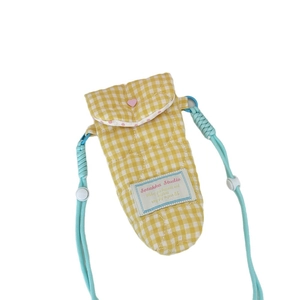 Quilted yellow checkered camera bag with heart stitching and blue adjustable strap