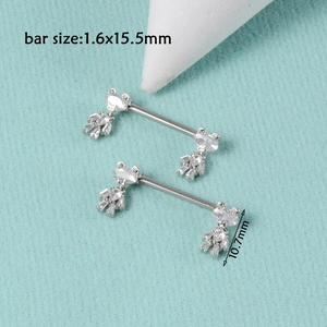 Macro detail of steel nipple ring with zircon heart pendant and 1.6x15.5mm size guide