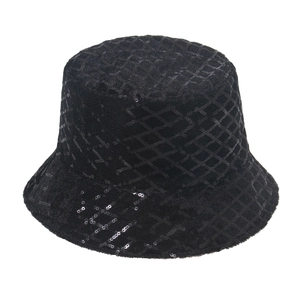 Detail of black sequin bucket hat featuring textured diamond pattern and shiny finish