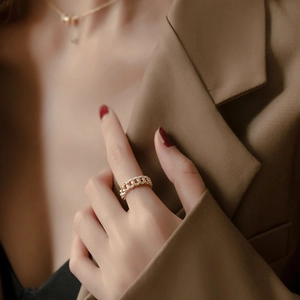 Golden micro-paved zircon chain ring for women shown on model with luxury styling