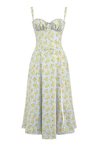 Detail of light blue floral midi dress with tie-front bust and side slit on white background