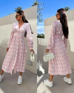 Detail of floral V-neck maxi dress with front buttons and long sleeves on model