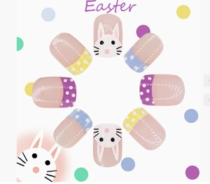 Detailed close-up of Easter press-on nails with cute bunny faces and colorful polka dots