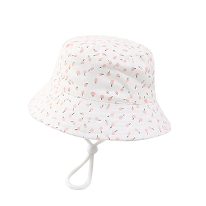 Breathable white cotton baby bucket hat with cute pink cherry print and adjustable chin strap