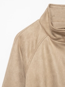 Close-up of khaki suede jacket featuring a stand collar and raglan sleeve detail