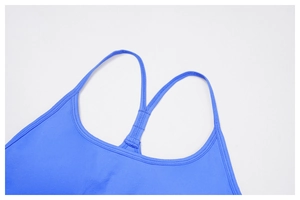 Detailed view of royal blue sports bra straps with reinforced Y-back stitching