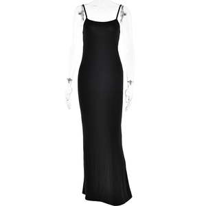 Detail of slim fit black backless maxi dress with thin straps on professional mannequin