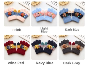 Close-up of knit toddler gloves featuring 3D cartoon fish and colorful pom-poms in 6 colors