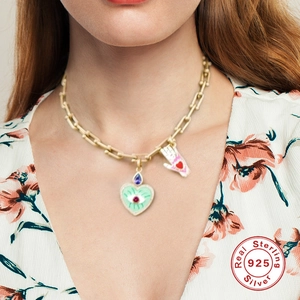 S925 sterling silver gold necklace with heart evil eye and palm pendants on model
