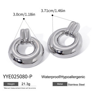 Detail view of geometric circle earrings in stainless steel with 3.0cm x 3.71cm dimensions