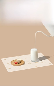 Waterproof disposable baby placemat featuring cute cat paw prints and yarn ball design