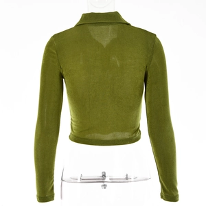 Detail view of olive green ribbed knit texture on a long sleeve lapel cropped shirt