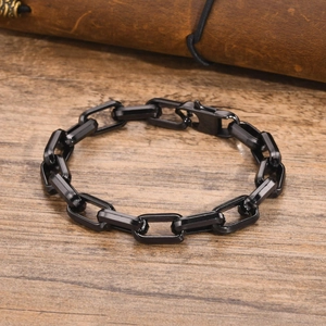 Minimalist black stainless steel square link chain bracelet with lobster clasp on wood
