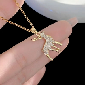 Golden pony pendant necklace with sparkling cubic zirconia pavé on a delicate chain